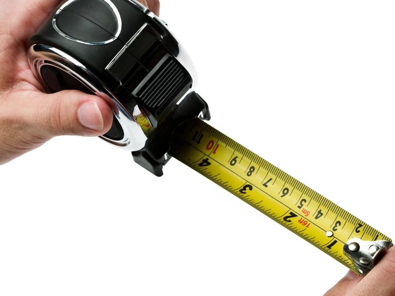 person holding measuring tape