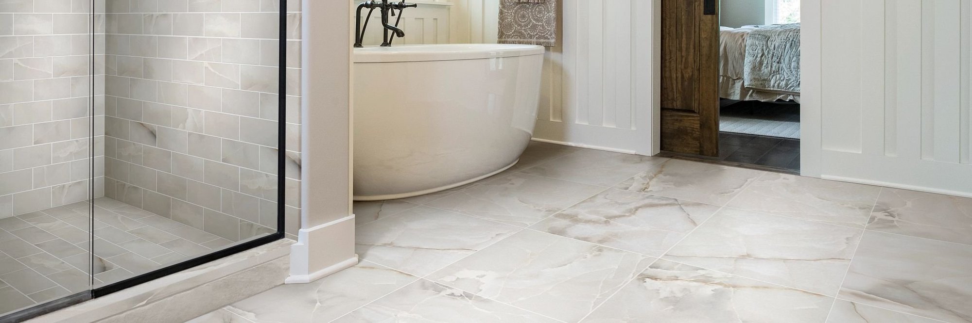 tile floors in bathroom with bath tub and shower